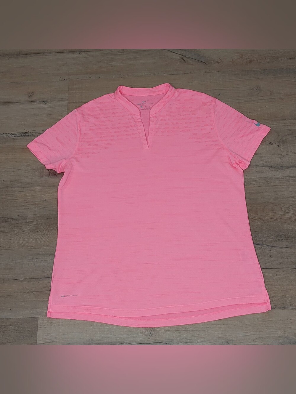 Women's Nike Zonal Cooling short-sleeve V-neck golf shirt.